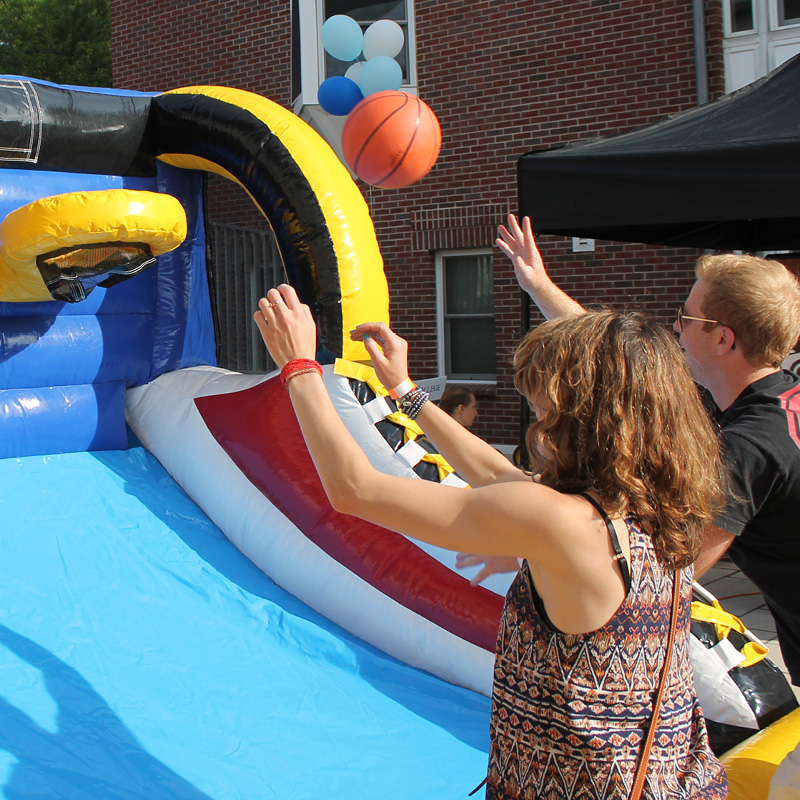 man and woman playing pop a shot